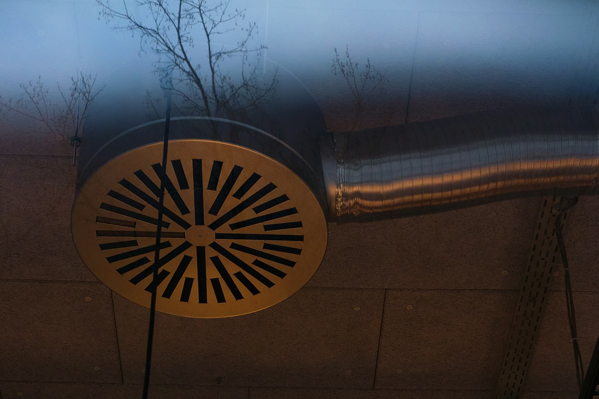 A round ceiling air diffuser seen from below