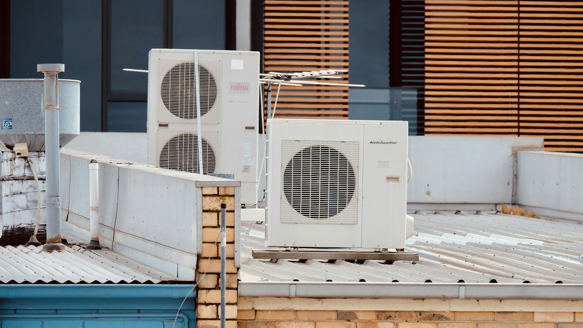 Air conditioning condensers in a row on a flat roof