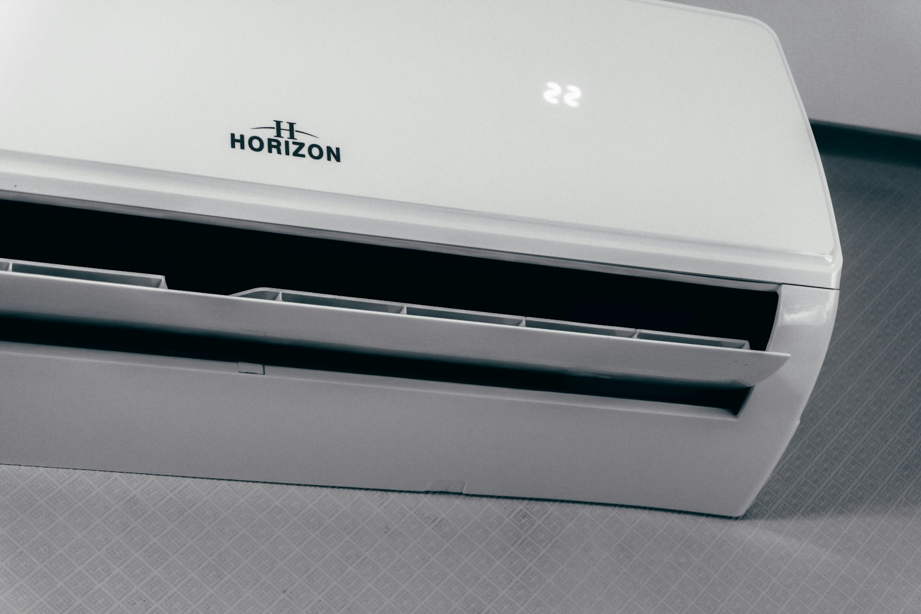 A white wall-mounted indoor unit of a ductless mini-split